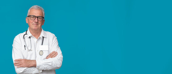 Doctor in eyeglasses on turquoise background with space for text.