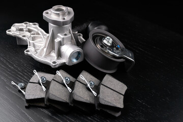 Close up auto parts spare parts car on grey background. Large number rotate on turntable around its axis. Auto parts store. Suspension and engine parts.