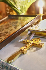 On the throne in the church lies a cross with a crucifix.