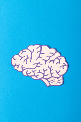 Vertical composition of white and purple human brain, on blue background with copy space