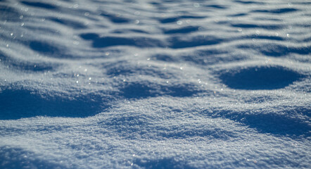 winter snow background - snow covered surface and artistic bokeh