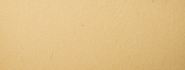質感のある黄土色の和紙の背景テクスチャー