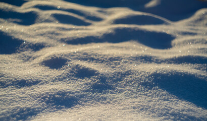 winter snow background - snow covered surface and artistic bokeh
