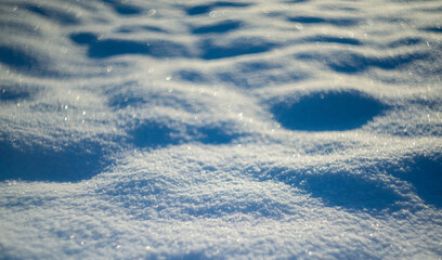 winter snow background - snow covered surface and artistic bokeh