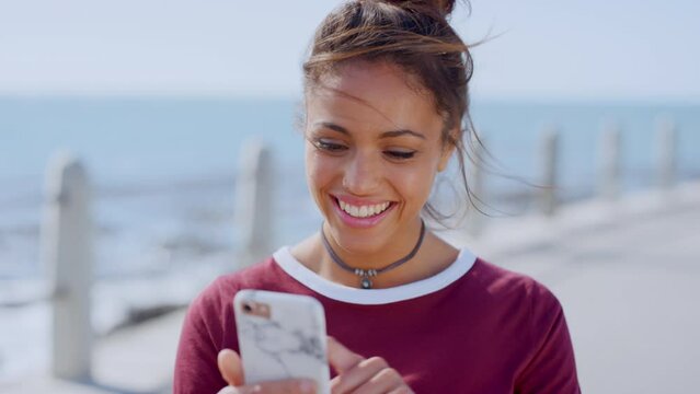 Woman, face or laughing at phone by beach, ocean or sea on social media app, funny internet meme or dating profile picture. Happy smile, student or mobile technology for comic joke in travel location
