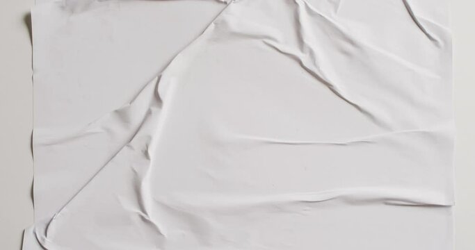 Video of close up of white creased fabric with copy space