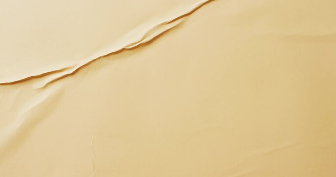 Video of close up of yellow creased fabric with copy space