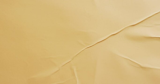 Video of close up of yellow creased fabric with copy space