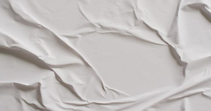 Video of close up of white creased fabric with copy space