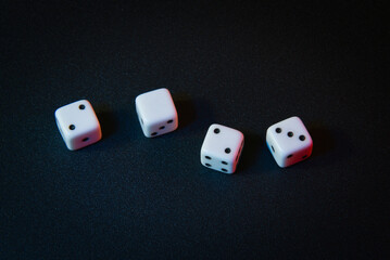 Conceptual photo: cubes with the dropped combination 2023. A photo with a symbolic beating of the date of the year - 2023. White dice on a dark background with an unusual combination of numbers.