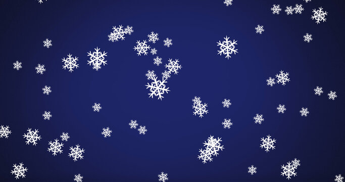 Image off falling snow over dark background