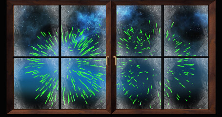 Image of window and snow with green christmas and new year fireworks exploding in night sky