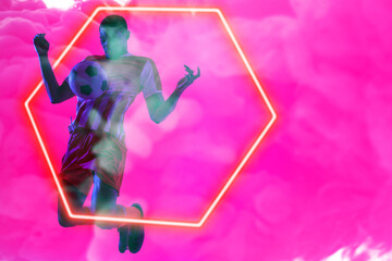 African american male player juggling with ball by illuminated hexagon over pink smoky background