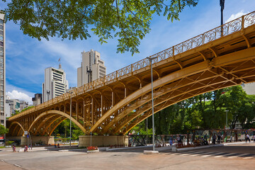 SAO PAULO - DECEMBER 07, 2017: Famous Santa Ifigenia Viaduct in downtown Sao Paulo on a sunny day with some people waiting for buses at the Bus Terminal located below the viaduct