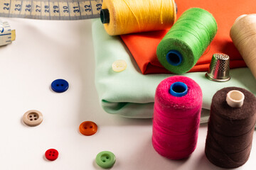 Composition of sewing equipment on white background