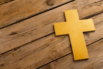 Composition of ash wednesday cross and copy space on wooden background