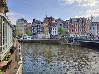 Amsterdam canal and building facades landmark city view. Amsterdam at spring.
