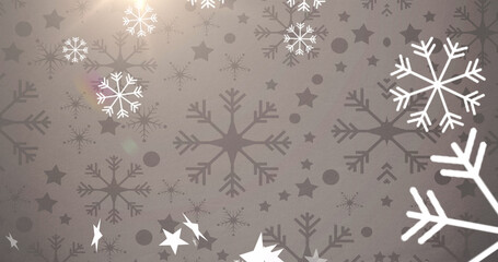 Multiple stars and snowflakes icons floating and spot of light against grey background