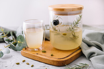 Summer cold tea and fresh herbs rosemary in glasses