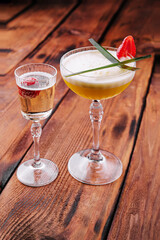 sweet alcoholic orange cocktail with foam and champagne