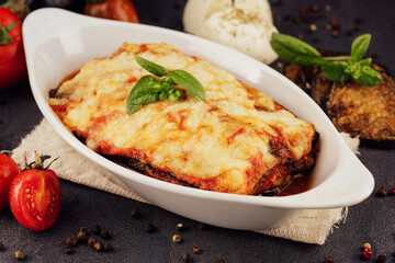 Delicious eggplant lasagna in baking dish 