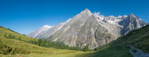 Naklejka na ściany i meble The panorama of Grand Jorasses massif from Val Ferret valley in Italy - Trekking Mont Blank.