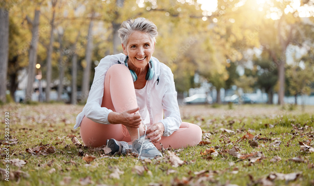 Sticker Fitness, shoes and old woman in park for workout, cardio training or morning running. Happy senior female, fitness and tie sneakers on grass lawn to start exercise, healthy lifestyle or body wellness