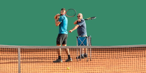 Aging Youthfully concept. Active elderly man at tennis training. Vitality, sports activity, healthy lifestyle in old age. Young coach give tennis lesson to old eged senior on court. Banner, copy space