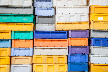 A stack of fishing crates boxes at a small german harbour on the baltic sea which creates a colourful background Motive 