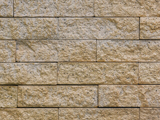 Naklejka premium Sandstone building blocks, Rough texture of a brick wall made of