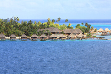 Overwater bungalows on Bora Bora island, French Polynesia, South Pacific Ocean. - obrazy, fototapety, plakaty