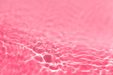 Transparent clear water surface texture with splashes, waves and bubbles toned in magenta Trendy abstract nature background with shadows and lights reflection. Water waves in sunlight. Overlay effect.