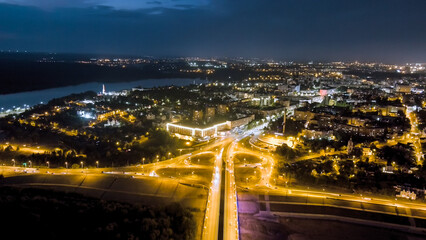 Fototapeta na wymiar Kaluga, Russia. Entrance to the city center of Kaluga Gagarin interchange and Gagarin bridge. Night illumination, Aerial View