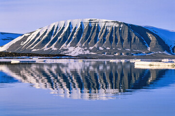 Mountain reflection in water at Svalbard