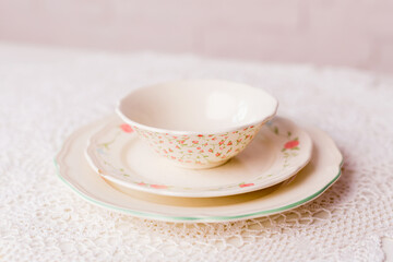 Closeup of porcelain plates and bowls