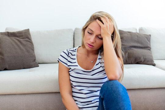 Pensive young woman with eyes closed thinking pondering, thoughtful biracial millennial female lost in thoughts, suffer from depression or miscarriage, psychological help concept.