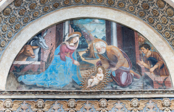 AOSTA, ITALY - JULY 14, 2018: The fresco of Nativity on the facade of Cathedral - Cattedrale di Santa Maria Assunta by Ambrogio Bellazzi da Vigevano from 16. cent.