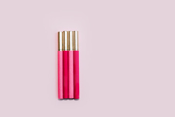 Multicolored cigarettes on a paper background, the concept of a bad habit.