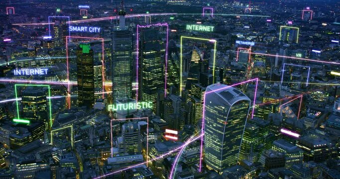 Aerial View of Futuristic Connected City at Night. London Skyline. Computer Network And Several High Tech Concepts: Metaverse, Smart City, 5G, AI, IOT, NFT. Europe.