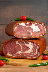 Turkish pastrami on wooden background. Antrikot is bacon made by drying with various spices and salt. Turkish cuisine delicacies