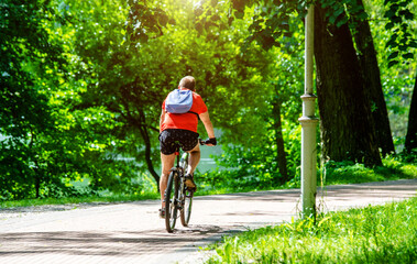 Naklejka premium Cyclist ride on the bike path in the city Park 