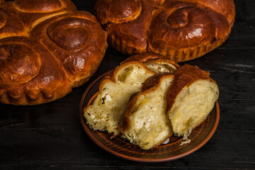 Fresh bread from the oven. Traditional cheese pie from Romania called Saralie. Homemade bread made from white wheat flour.