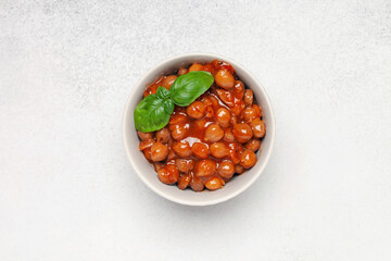 Piquant boiled  chickpeas in a sauce with pepper and prunes. Vegetarian or vegan food. Top view