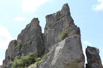 Rocks in the forest. Inaccessible boulders in the mountains. Ruins at the site of an ancient castle.