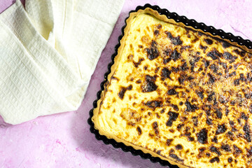 homemade algerian cheese quiche on wood table