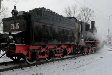 Fototapeta na wymiar Steam locomotive at the New Peterhof station, St. Petersburg, Russia, December 8, 2022