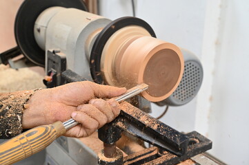 Lathe machine with wooden turning blanks in workshop