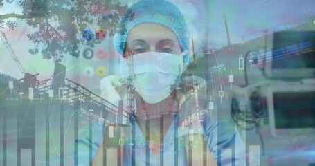 Animation of financial data processing over caucasian female doctor and cityscape - Powered by Adobe