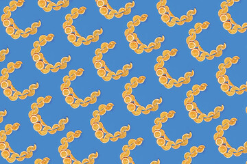 Vitamin C of dried oranges on blue background.Pattern.