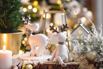 Happy New Year 2023. Christmas card with cute reindeer on a beautiful bokeh background. New Year's...